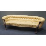 A Victorian showframe sofa, with button back and serpentine shaped front seat