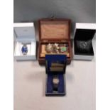 A jewellery box containing a collection of costume jewellery together with some watches