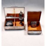 Two silver table cigarette boxes together with a miniature trophy, a shell salt and a vesta case (