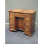 A George III mahogany kneehole desk comprising of seven drawers on bracket feet 79 x 89 x 50cm