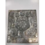 A Nepalese silver cased relief plaque, decorated with a mandala, Hindu deities and zodiac symbols