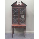 A George III style mahogany glazed top cabinet on stand, with frieze drawer, 200 x 82 x 48cm