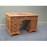 A late Victorian carved oak Green Man pedestal desk 123cm wide