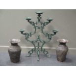 A reproduction cast iron pricket candelabra 104cm high, 87cm wide; together with a pair of metal