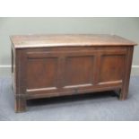 An 18th century oak coffer with three panelled front, 70 x 133 x 54cm