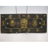 A possibly Tibetan rectangular metal embossed plaque gilt mounts