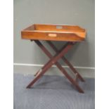 A mahogany butler's tray on stand