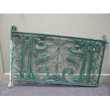 A green painted garden gate with leaf and scroll decoration, 131cm wide x 78cm high approx.