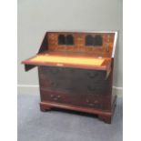 Made by Alfred Charles Clayton 1860 to 1928 a George III style mahogany bureau with key and burr