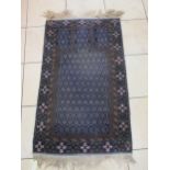 Two Belouchi type rugs, another and a mat (4)
