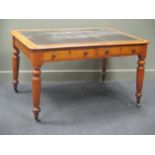 A Victorian mahogany two drawer writing table on turned legs and smoker's bow armchair (2)
