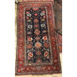 A Bijar blue and red ground rug, 192 x 98cm