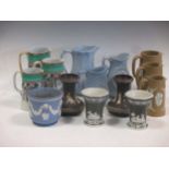 A collection of relief moulded jugs, a game pie dish, vases etc