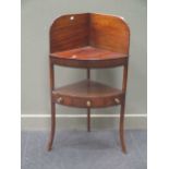 A Regency mahogany corner wash stand 107cm high and 60cm wide