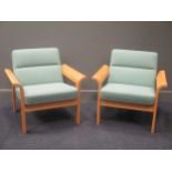 A pair of Magnus Oleson Danish arm chairs (2)