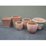 A plain terracota circular planter 56cm, another 52cm, a square terracota planter 43cm and five