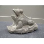 A carved granite figure of a frog, 49cm high, 64cm long, 41cm wide