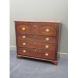 A Georgian mahogany secretaire chest with line inlaid decoration, the secretaire drawer inlaid