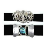 A Victorian silver Art Nouveau nurses buckle together with an Arts & Crafts example (2)