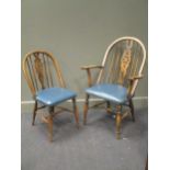 A set of six 20th century wheel back dining chairs to include two carvers