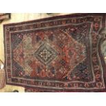 A worn red and blue patterned rug, 194 x 132cm; and another rug, Hamadan, 206 x 146cm (2)
