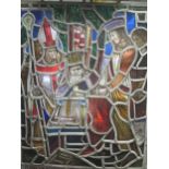 A leaded stained glass panel of a medieval scene, 70x47cm in a white painted window frame