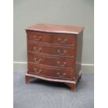 A small reproduction serpentine front chest of drawers, 70cm wide