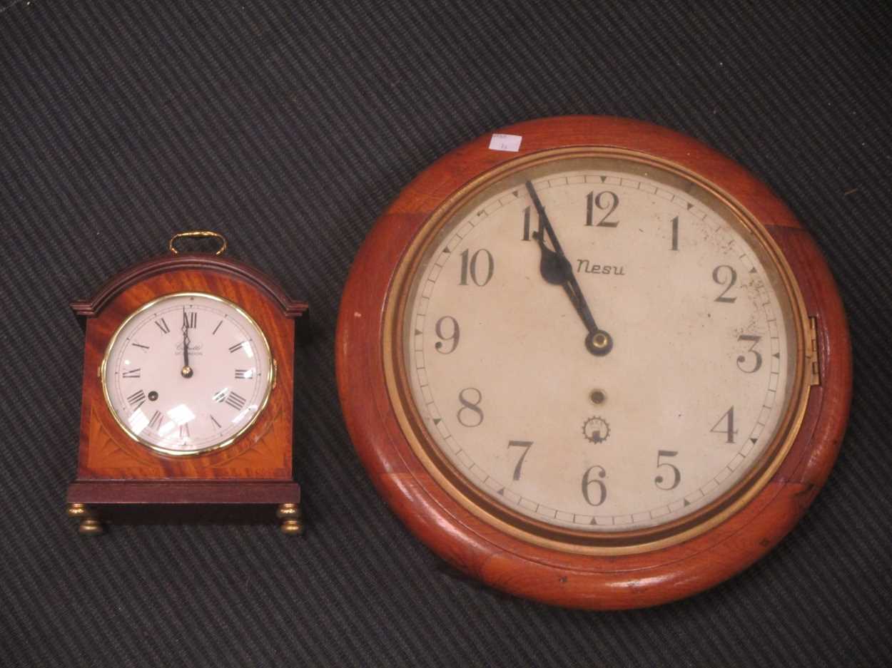 A modern mantle clock by Comitti in mahogany case 24cm high and a wall clock with hes movement