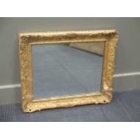 A 19th century carved gilt woof frame (now converted to a mirror) 53 x 63cm