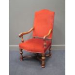 An 18th century style walnut hump back open armchair on turned legs joined by a central finial "X"