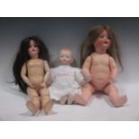 An early 20th century SFBG porcelain headed doll, various doll moulds, 20th century and a quantity