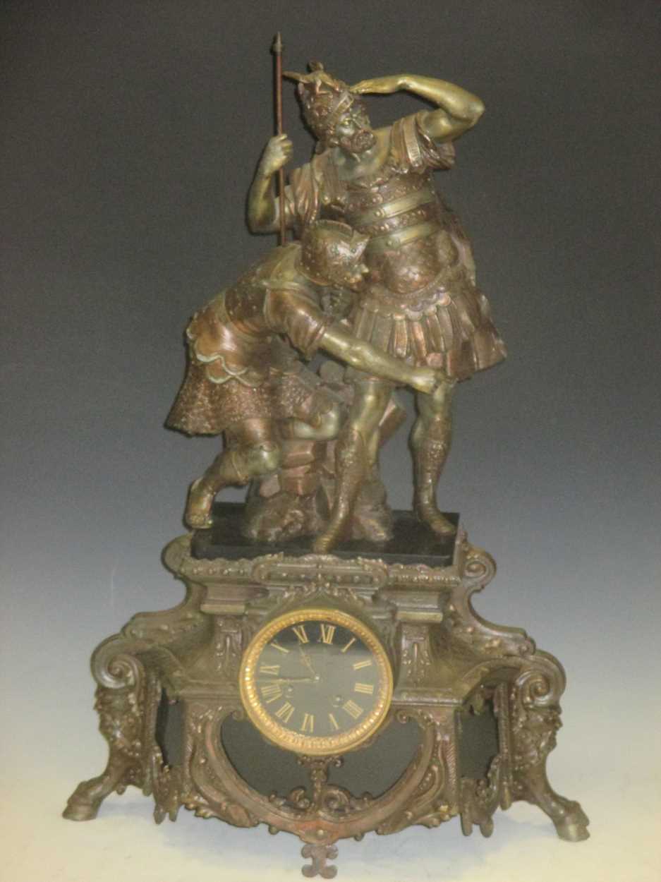 A bronze mantel clock with figural mounts, 64cm high