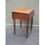 A George IV mahogany drop flap table with two drawers 82cm wide when open