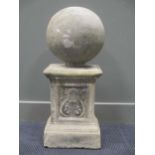 A composite stone sphere 32cm diameter, and a composite pedestal