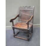 An early English oak armchair