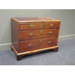 An 18th century cross banded red walnut caddy top chest of three graduating long drawers on