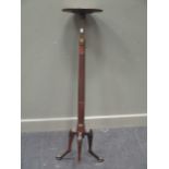 A George III mahogany adjustable torchere stand, with one leg broken