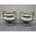 A pair of metal two handles garden urns with mounted rim 44cm wide (2)