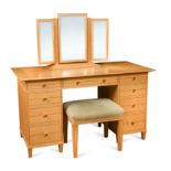 § David Linley, a sycamore dressing table and stool en suite,