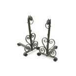 A pair of early 20th century wrought iron andirons,