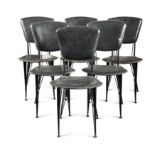 A set of six black vinyl upholstered dining chairs, probably Italian,