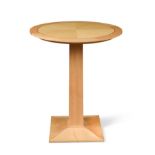 § David Linley, a sycamore circular pedestal table,