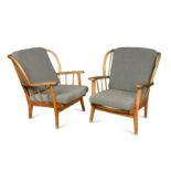 Attributed to Ercol, a pair of beech framed wingback lounge chairs,