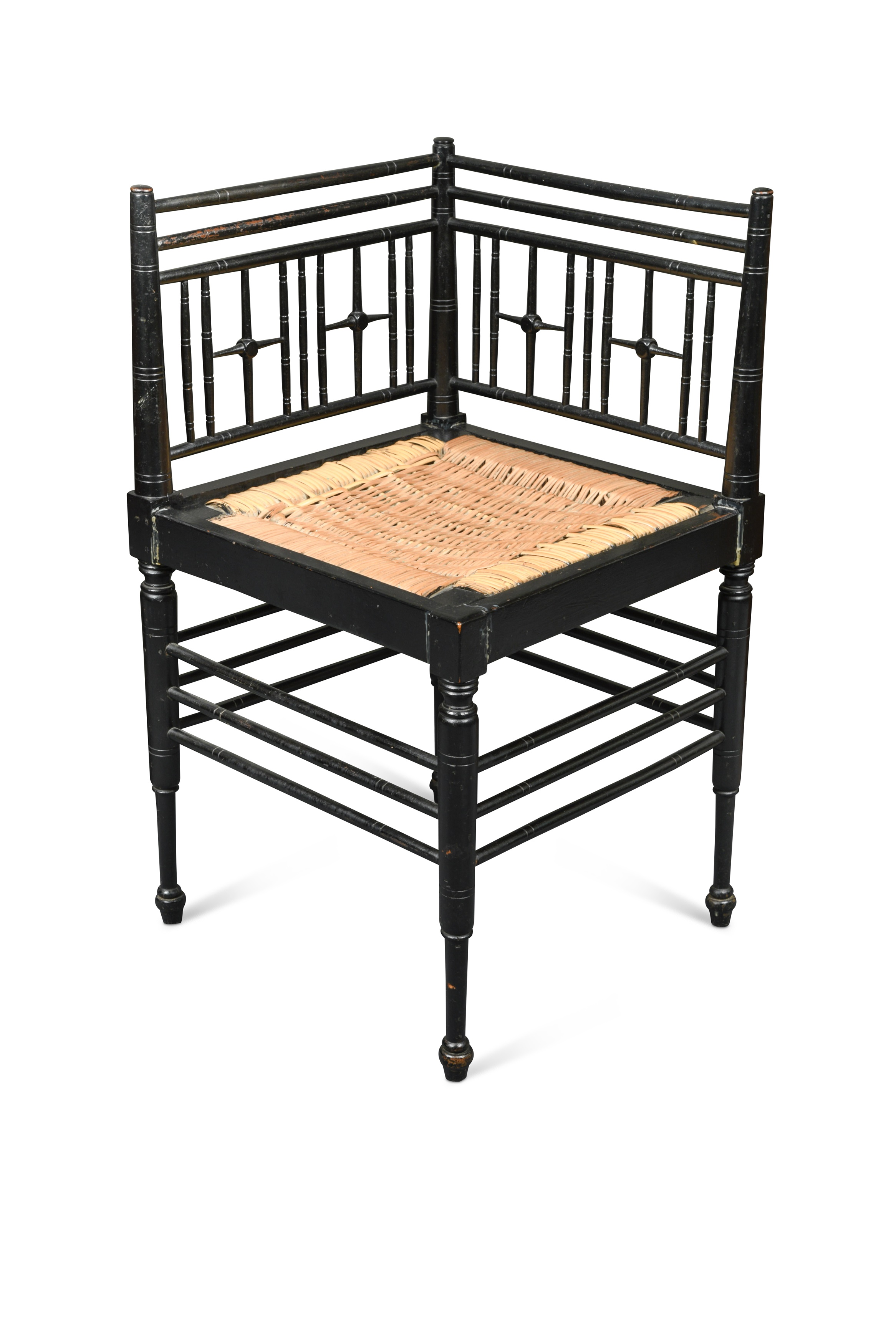 A Morris & Co. ebonised corner chair,