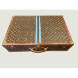 A Louis Vuitton monogrammed leather rigid suitcase,