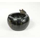 An early 20th century marble ashtray mounted with a bronze model of a French bulldog,