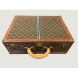 A Louis Vuitton monogrammed leather rigid suitcase,