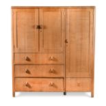 A Heal's limed oak Art Deco compactum wardrobe,