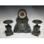 A late Victorian black marble clock garniture, 43cm high