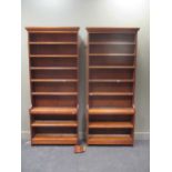 A near pair of walnut open bookcases with eight shelves, 226cm x 91cm x 28cm 226cm x 91cm x 28cm